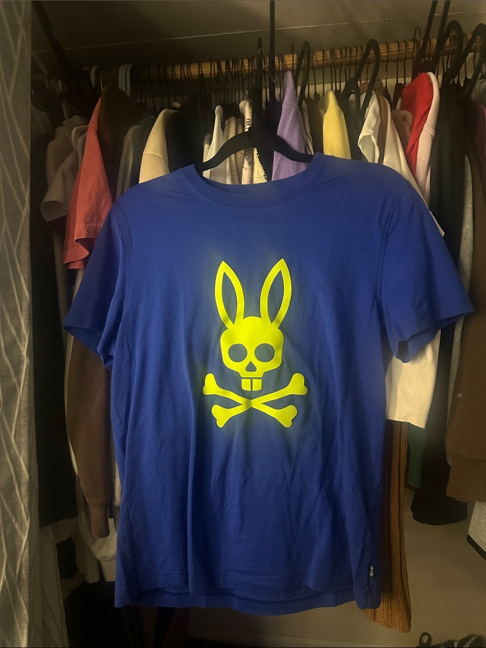 blue psycho bunny shirt with neon lable